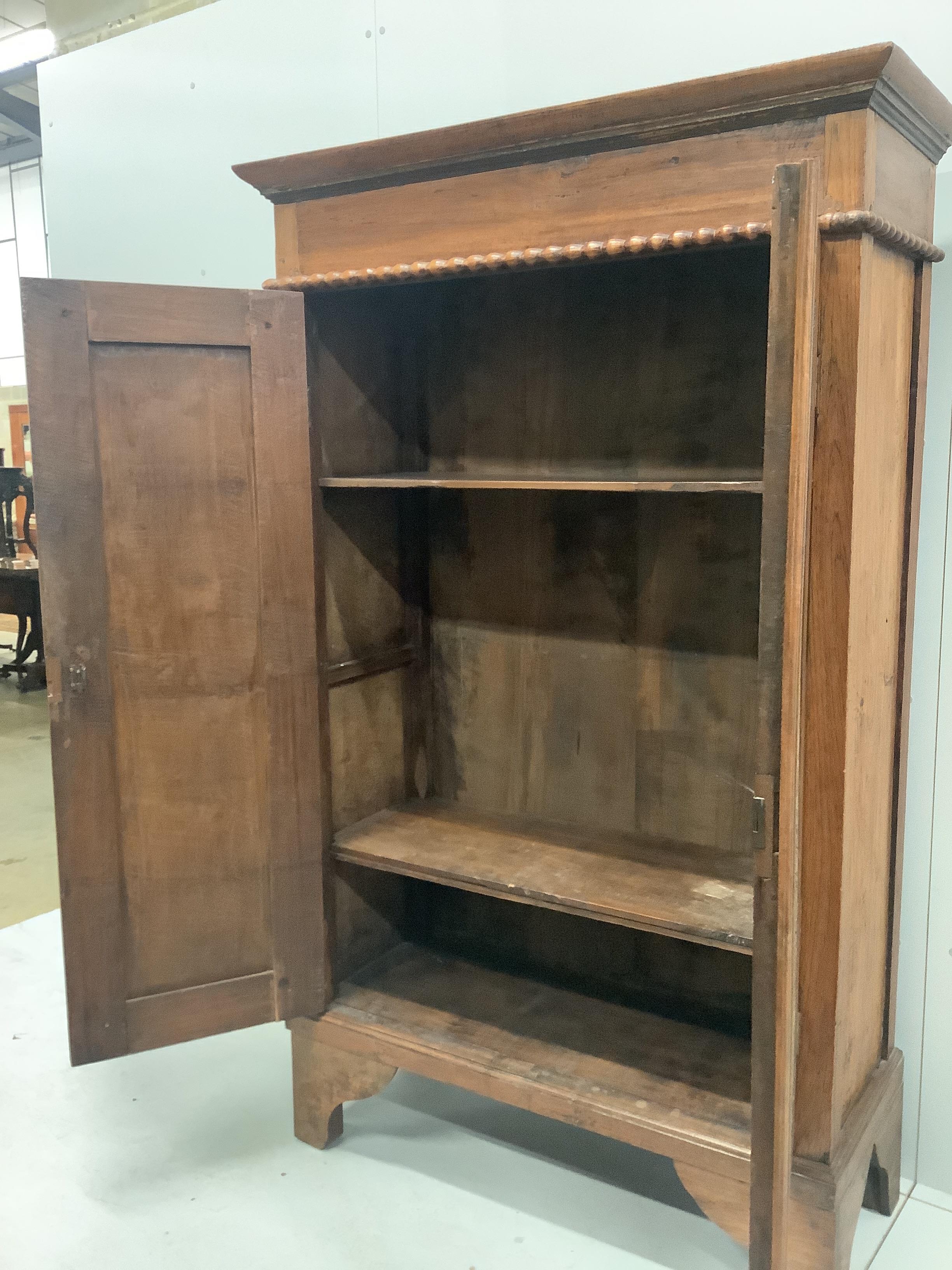 An Anglo-Burmese painted hardwood two door wardrobe, width 110cm, depth 43cm, height 181cm